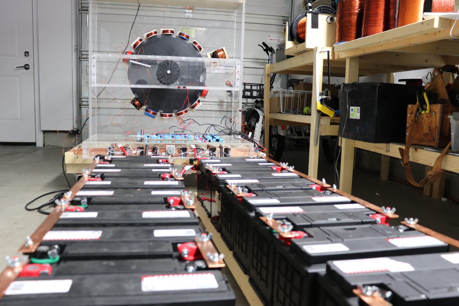 Pulse motor rotor rig and battery bank in the Limitless Potential lab